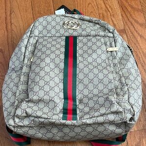 Beige Backpack with Iconic Pattern brand new with tags! Comes with dust cover!